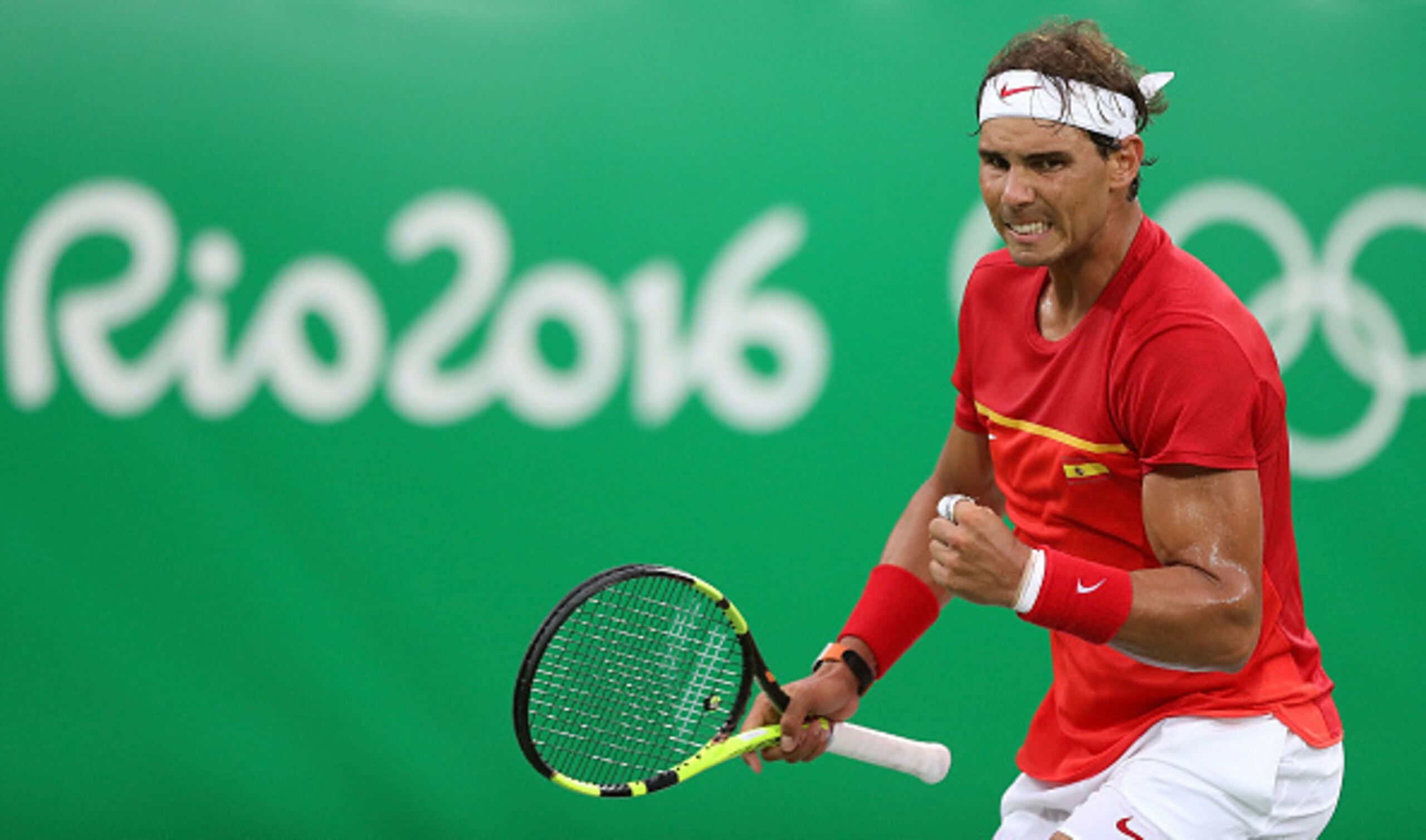 Rafael Nadal fist pumps after a winner during a match at the 2016 Summer Games.