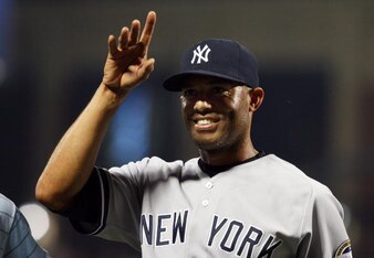 Mariano Rivera waves to the crowd after picking up his 500th career save.