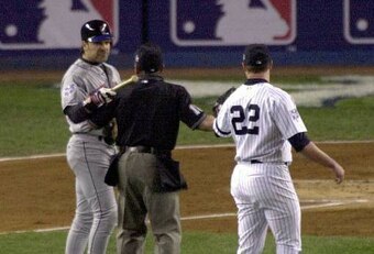Mike Piazza and Roger Clemens being separated after the infamous bat-throwing incident.