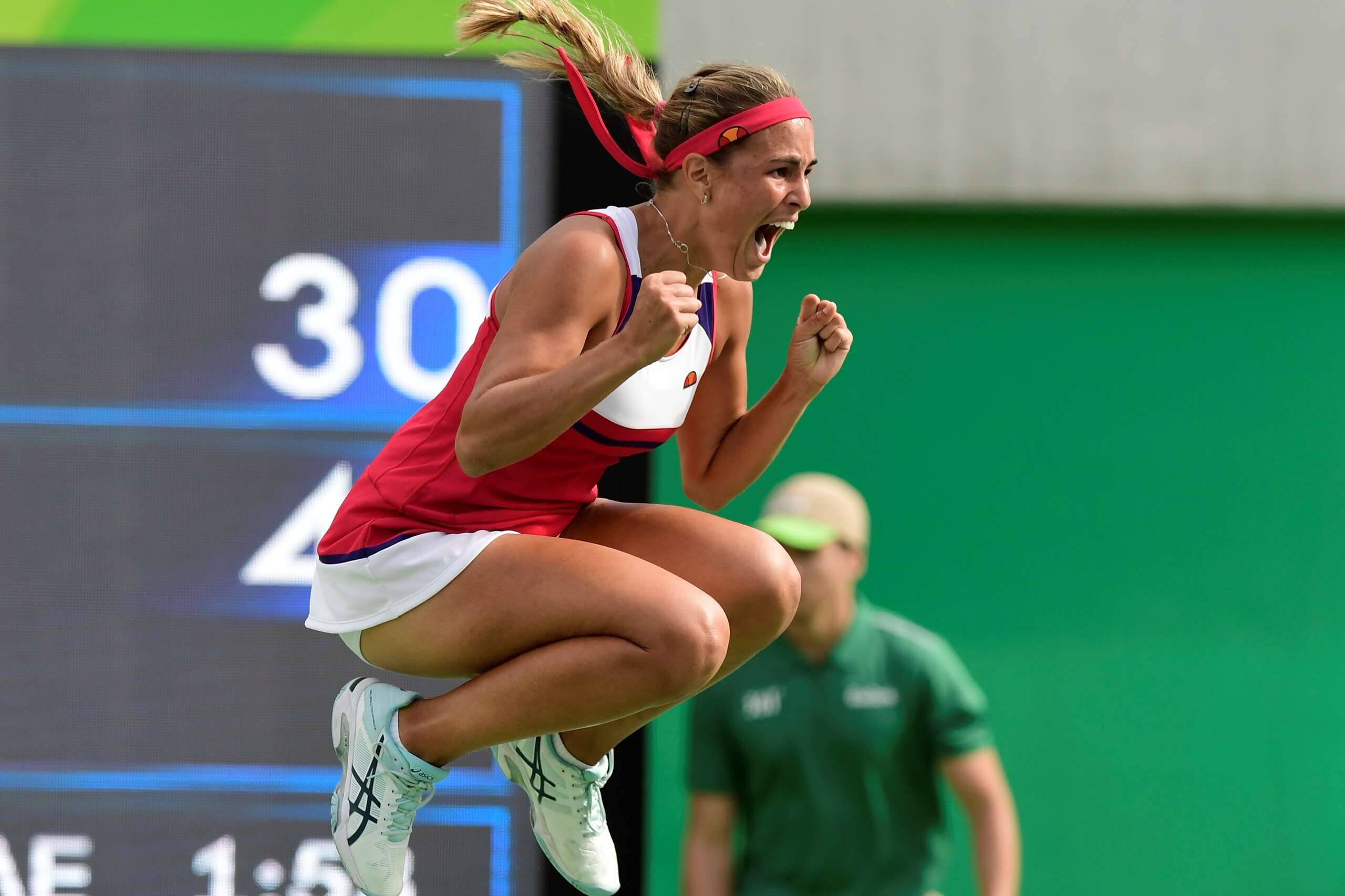 Monica Puig jumps for joy after winning her semifinals match at the 2016 Olympics in Rio.
