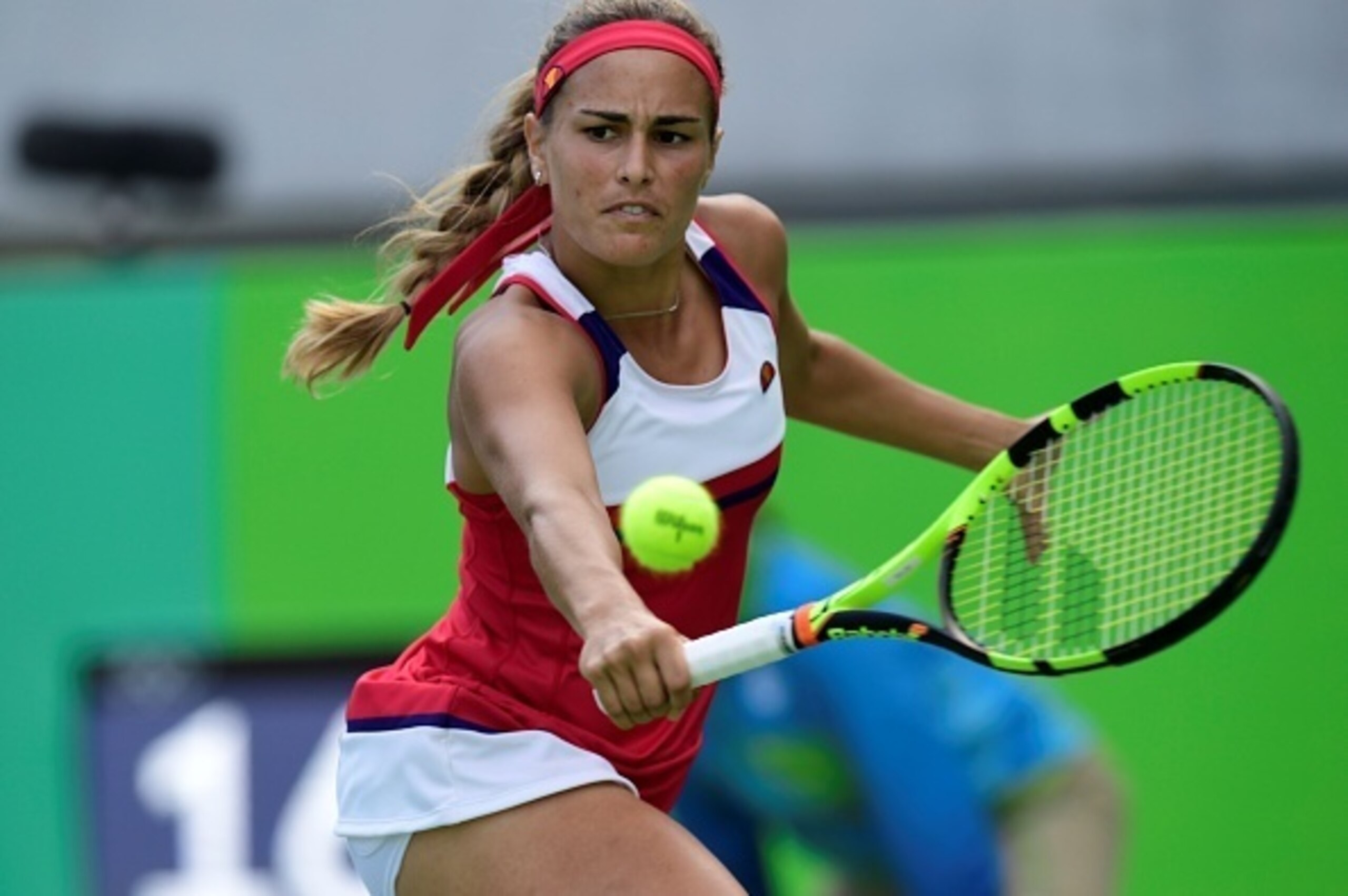 Monica Puig prepares to hit a backhand volley during a match at the 2016 Olympics in Rio.