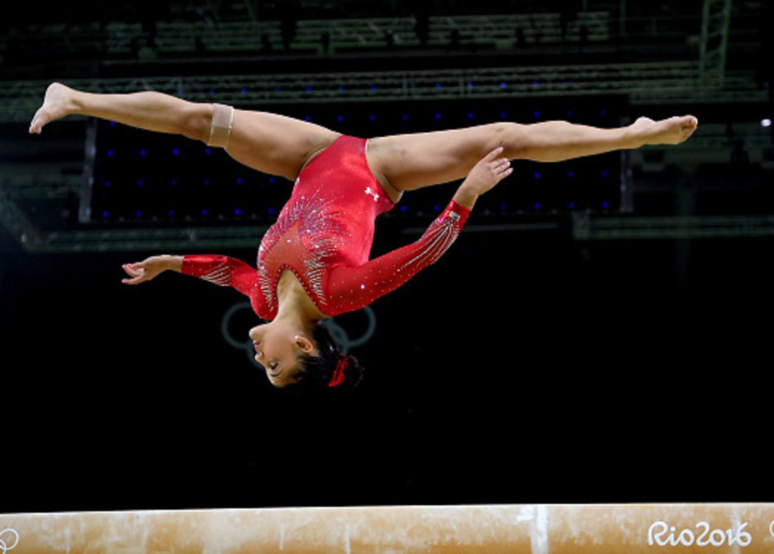 Laurie Hernandez spots the landing.
