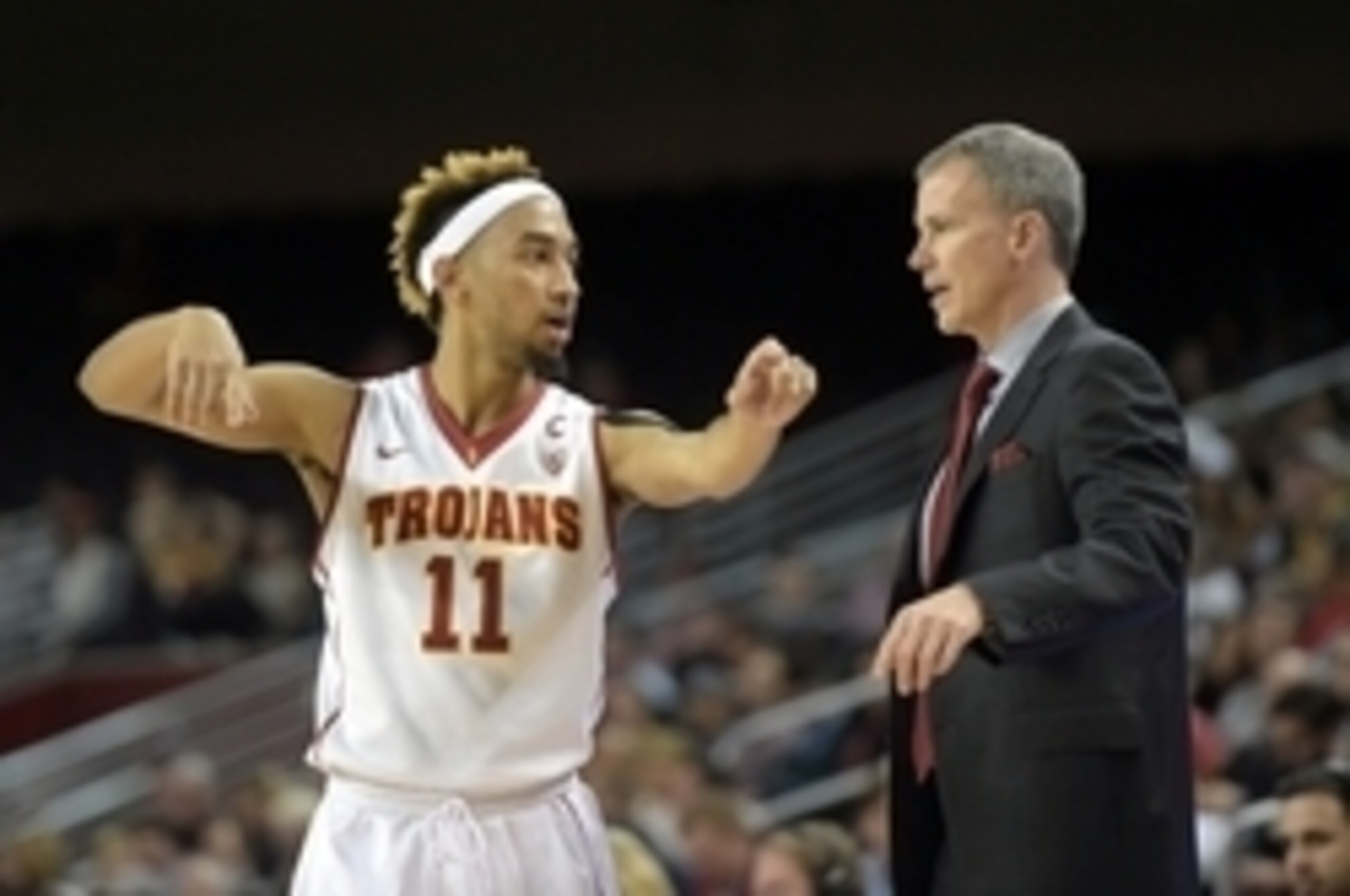Feb 17, 2016; Los Angeles, CA, USA; Southern California Trojans coach Andy Enfield (right) and guard Jordan McLaughlin (11) during an NCAA basketball game against the Colorado Buffaloes at Galen Center. USC defeated Colorado 79-72. Mandatory Credit: Kirby