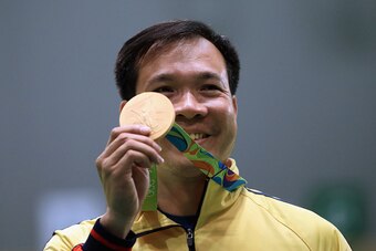 Vietnam's Hoang Xuan Vinh earns his country's first Olympic gold medal by winning the 10-meter air pistol shooting competition.