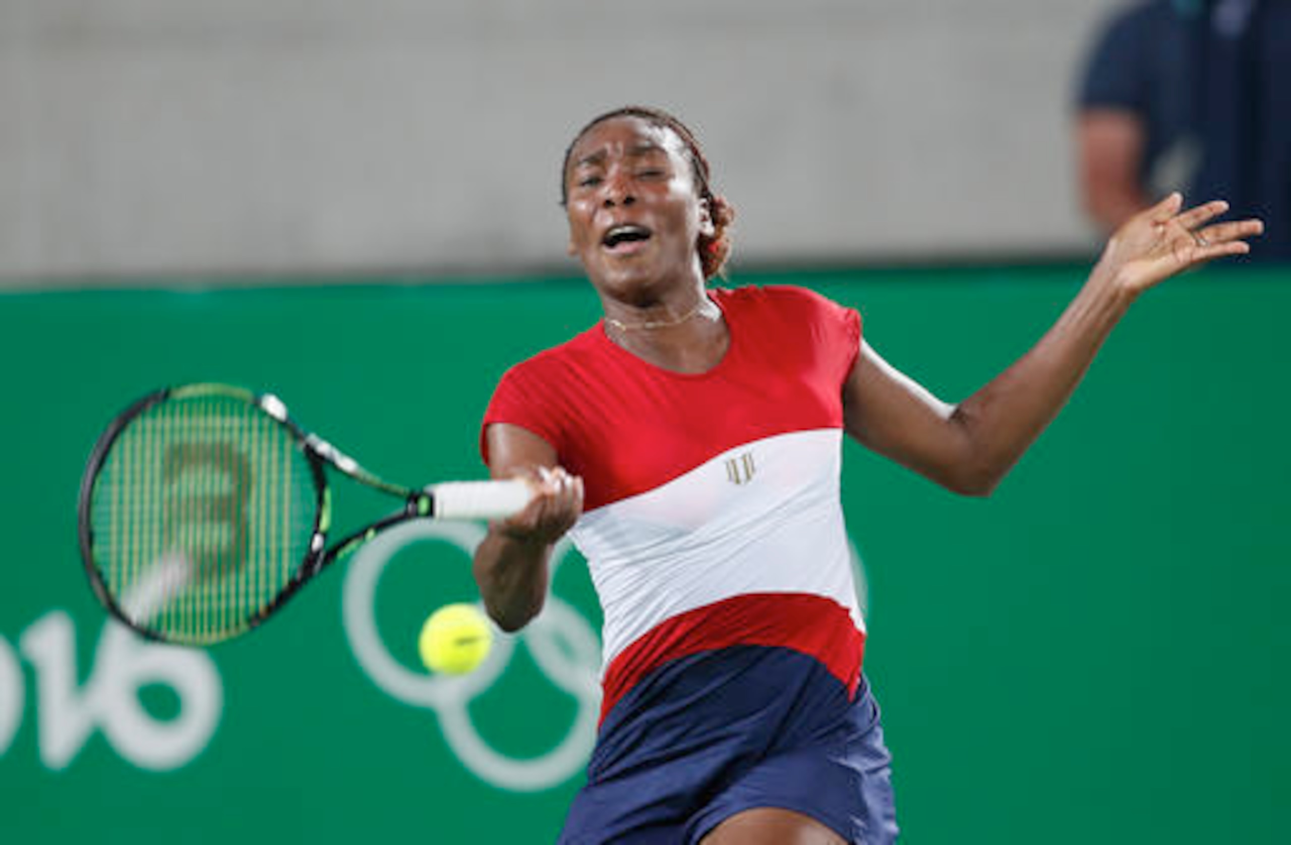 Venus Williams hits a forehand during a match at the 2016 Olympics.