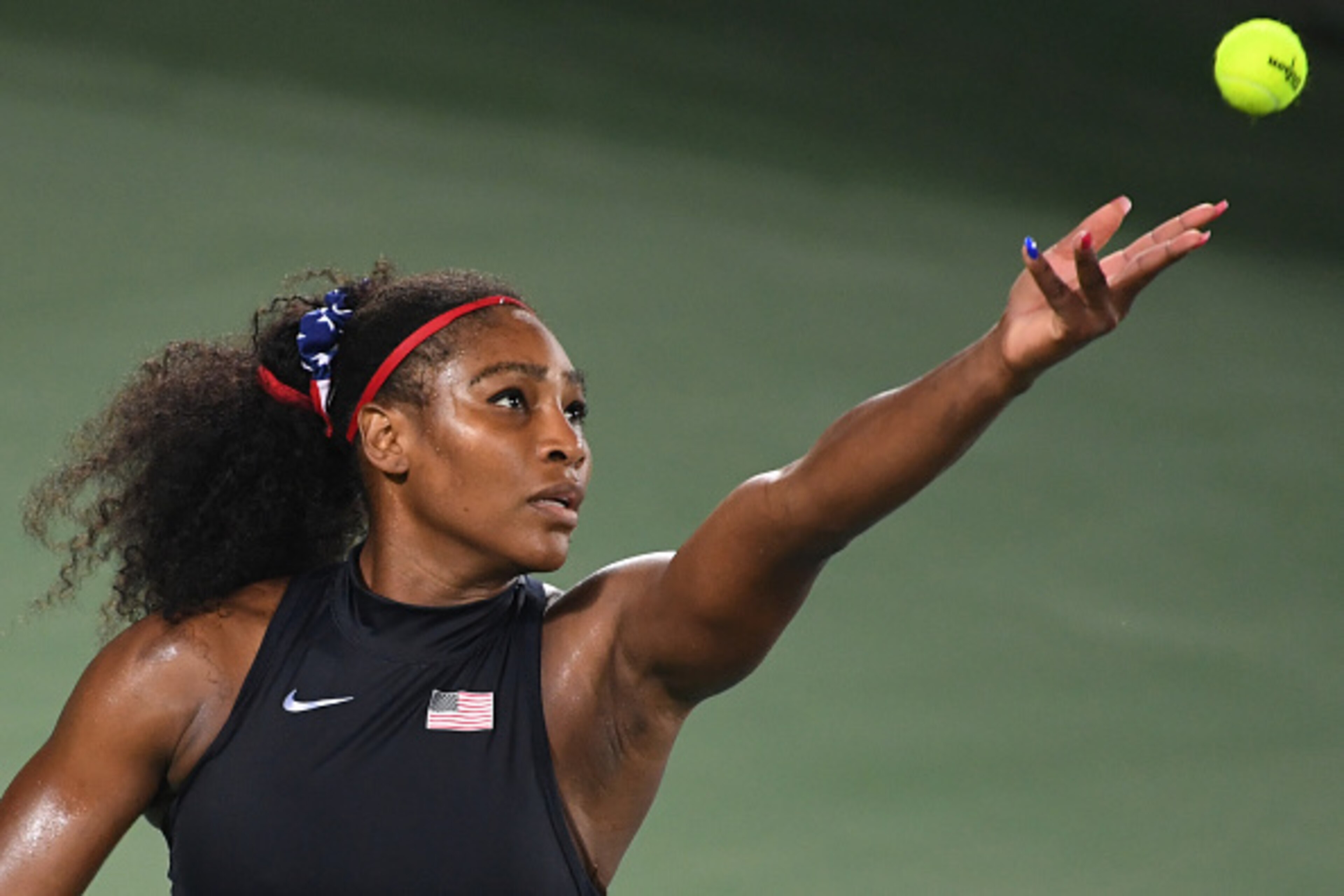 Serena Williams serves during the 2016 Olympics in Rio.
