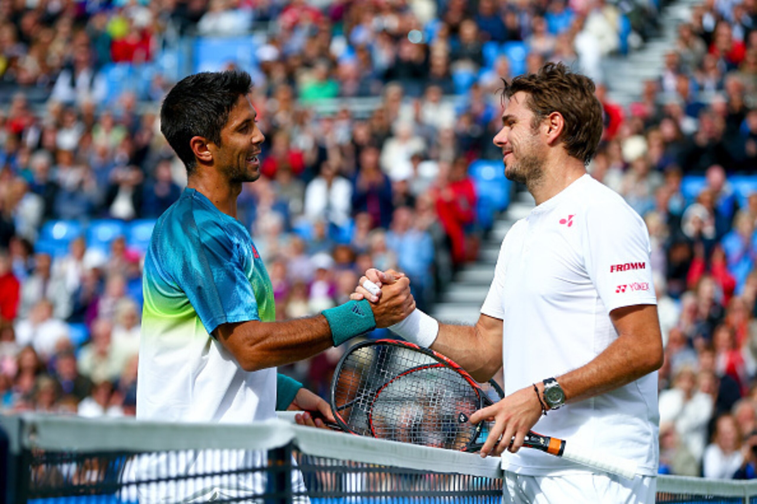 Fernando Verdasco and Stan Wawrinka shake hands after a match at the 2016 Aegon  tournament.