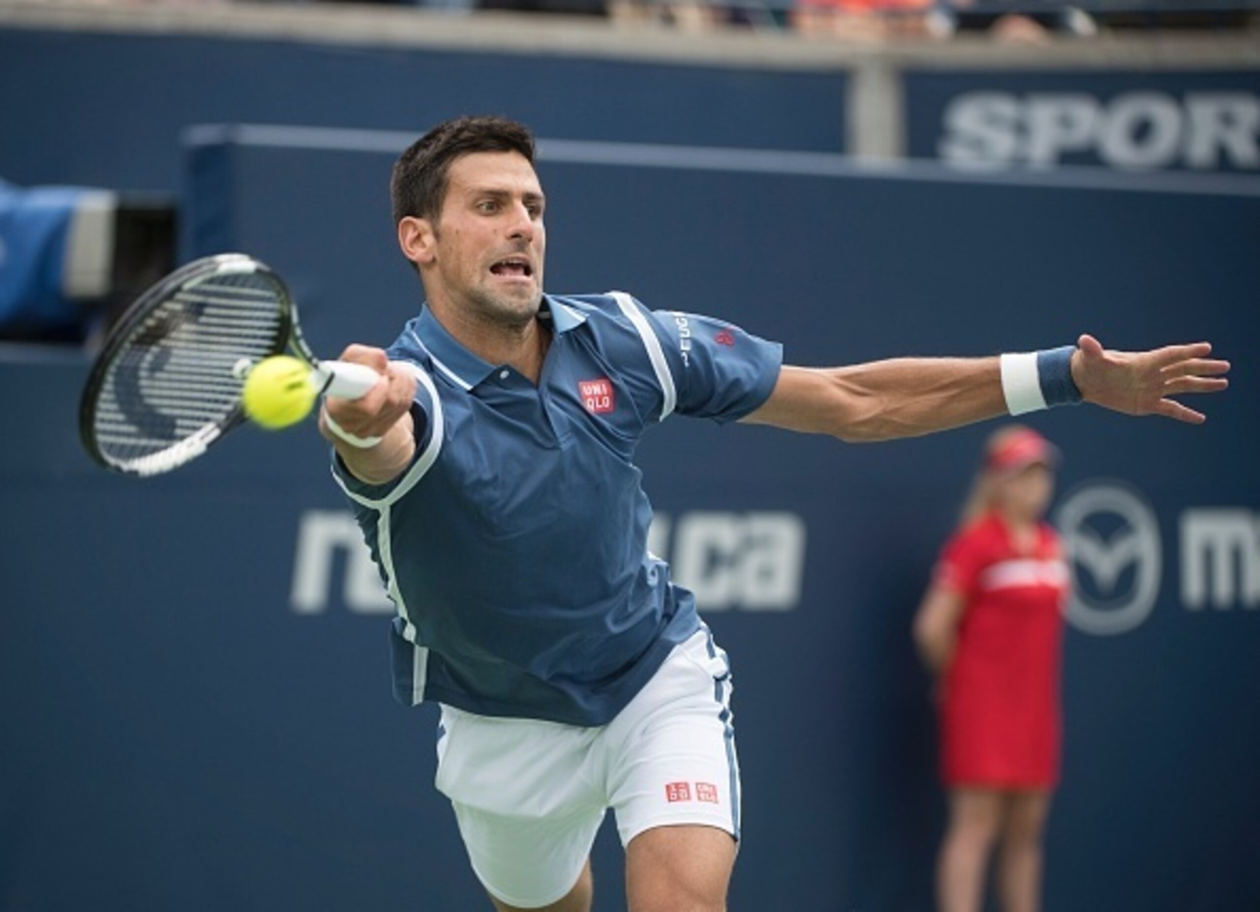 Novak Djokovic hits a forehand at the 2016 Rogers Cup.