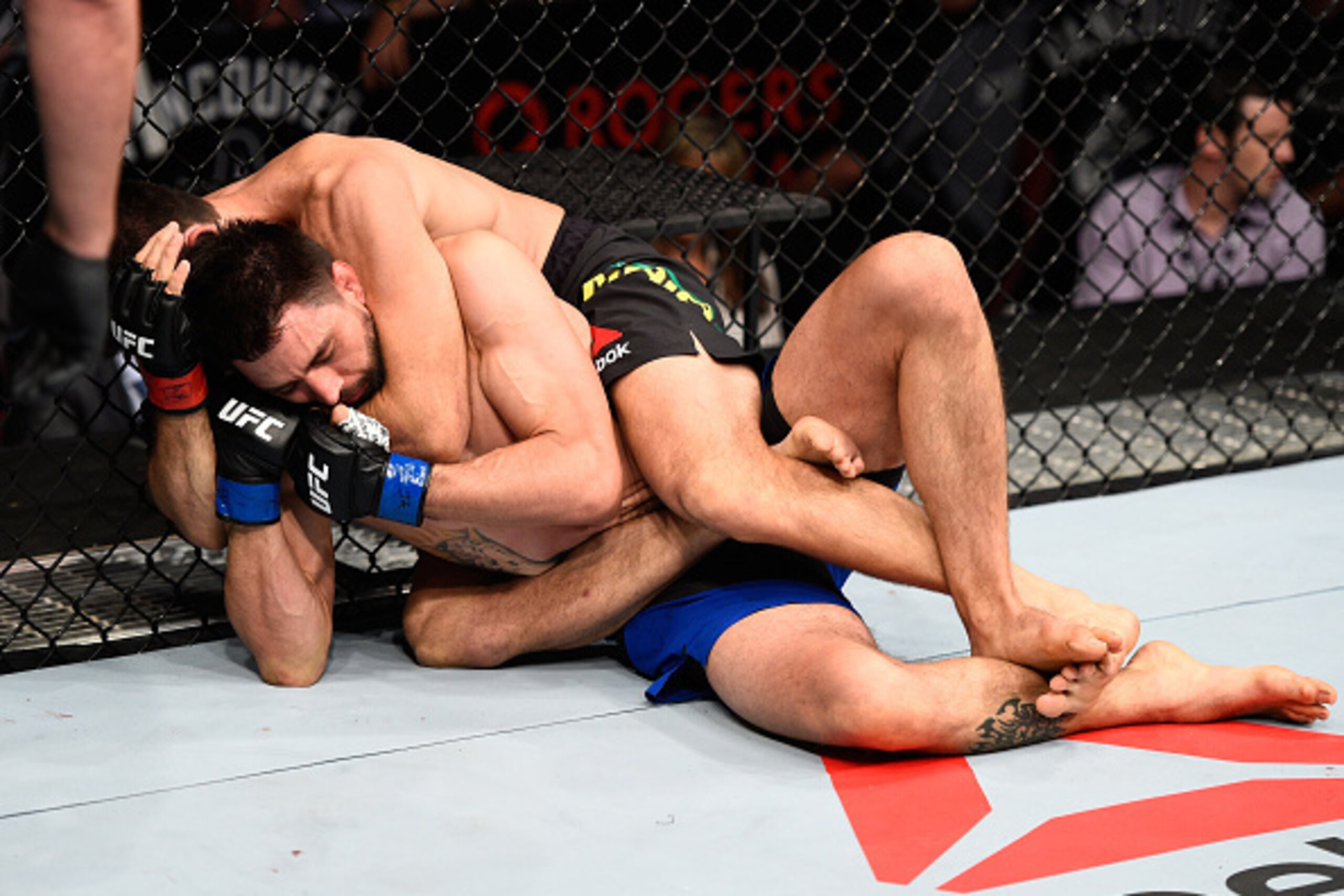 Demian Maia (top) chokes out Carlos Condit.