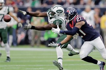New York Jets wide receiver Quincy Enunwa (81) reaches for a pass as Houston Texans strong safety Quintin Demps (27) defends the play during the second half of an NFL football game Sunday, Nov. 22, 2015, in Houston. (AP Photo/Patric Schneider)