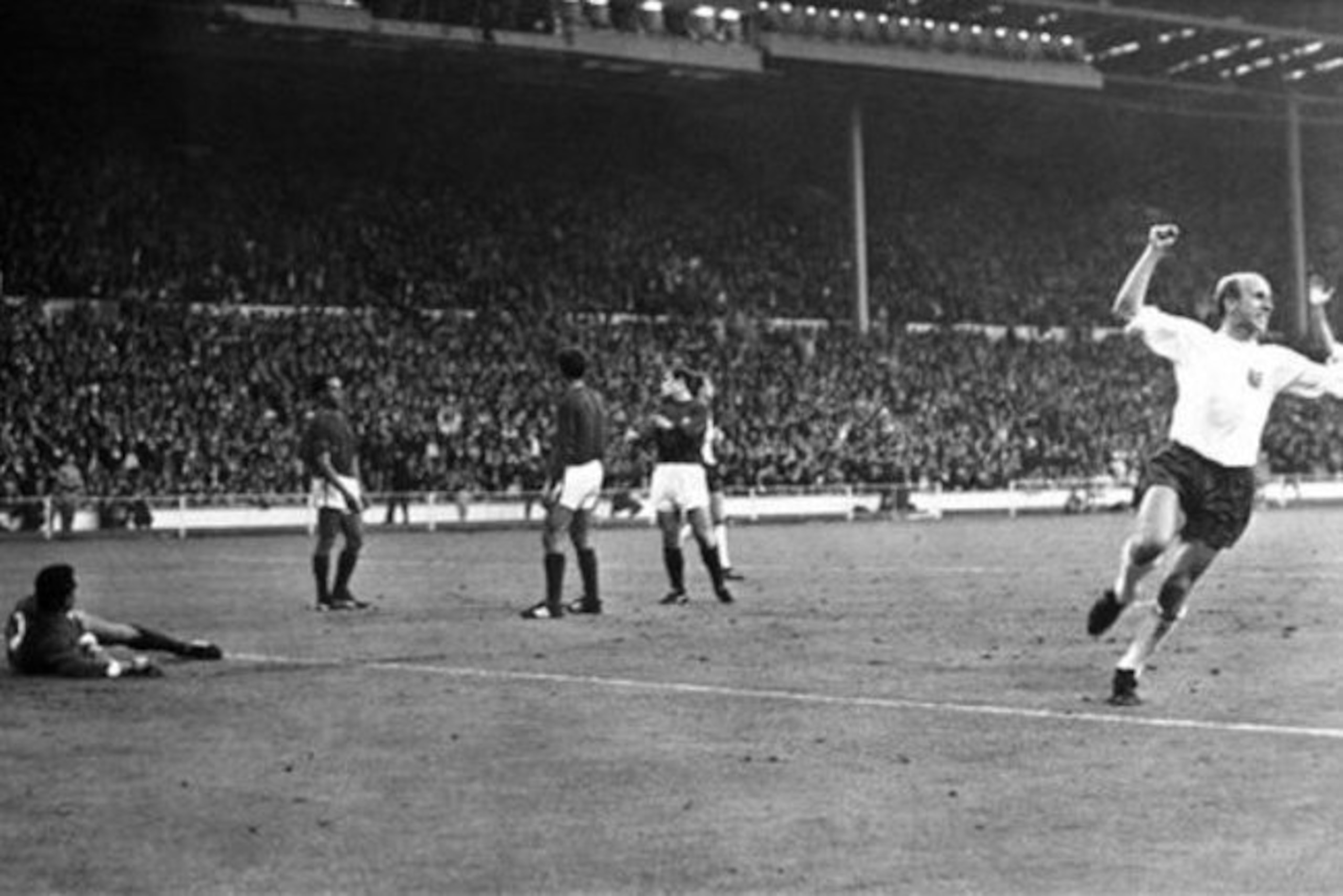 A pre-knighthood Bobby Charlton celebrates against Portugal at the 1966 World Cup.