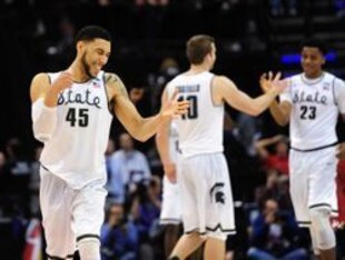 Denzel Valentine (45), Matt Costello (10) and Deyonta Davis (23)