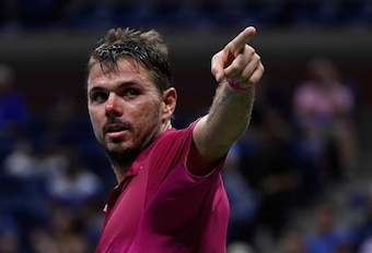 Wawrinka points to the crowd in celebration during his quarterfinal win.