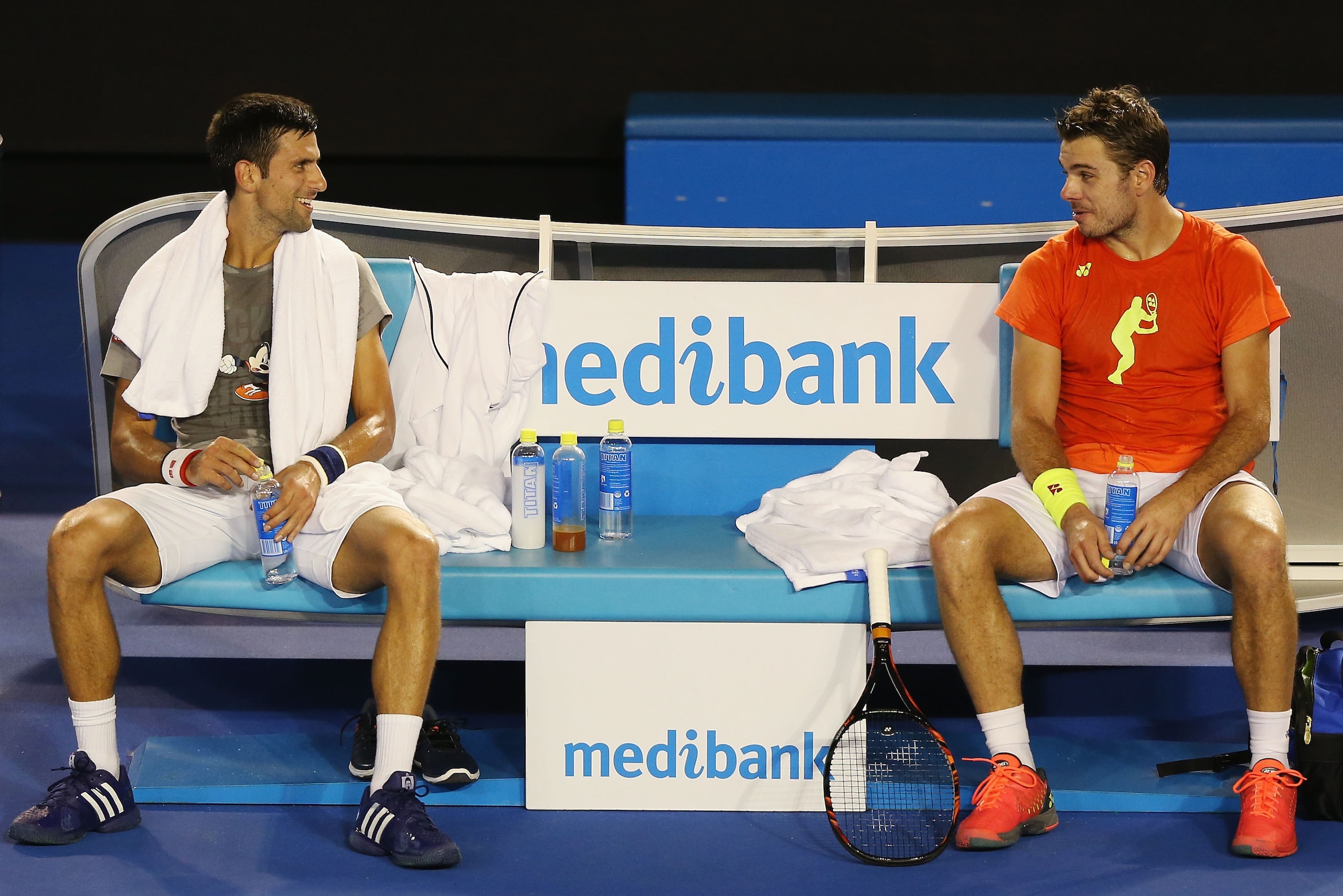Djokovic and Wawrinka share a laugh while practicing at the 2016 Australian Open.