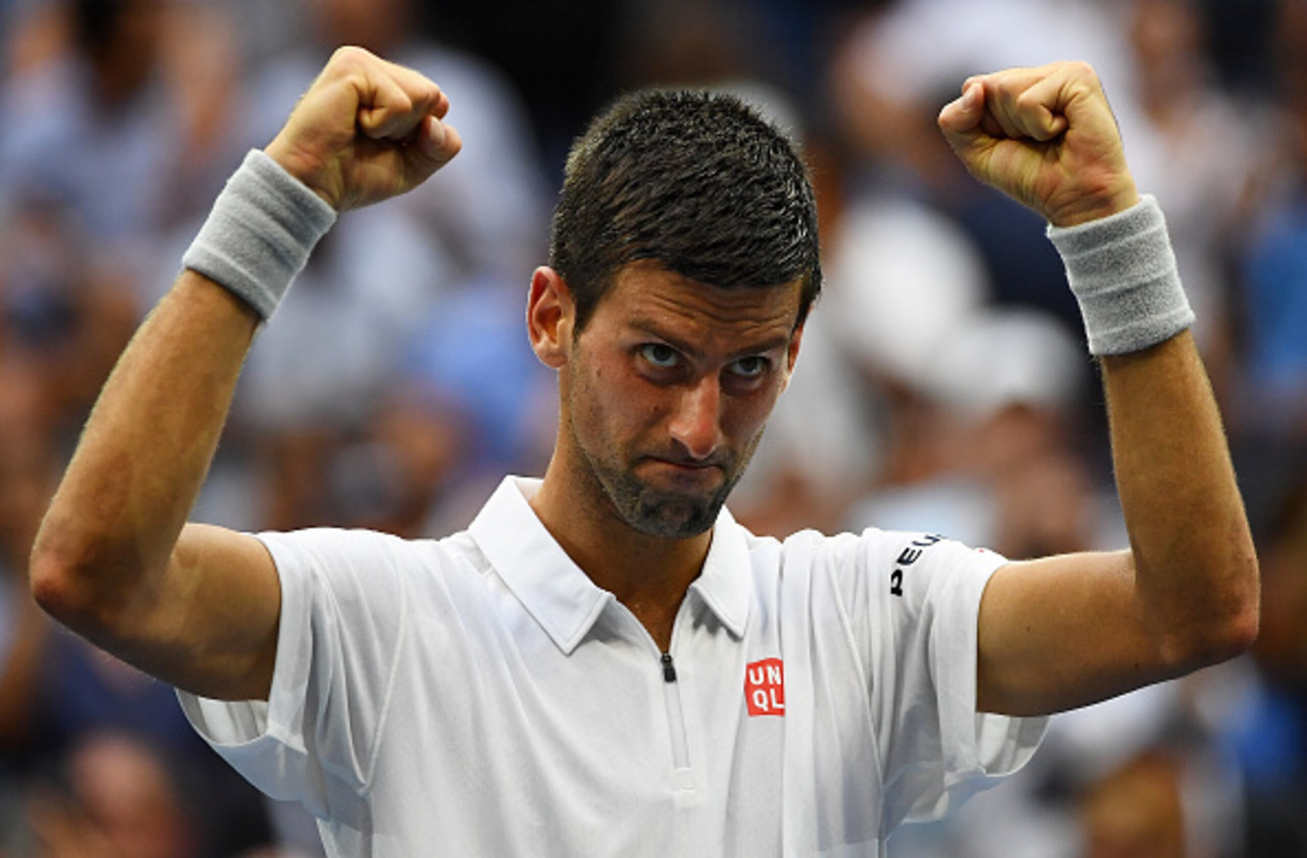 A tired Djokovic celebrates after defeating Monfils in the semifinals.
