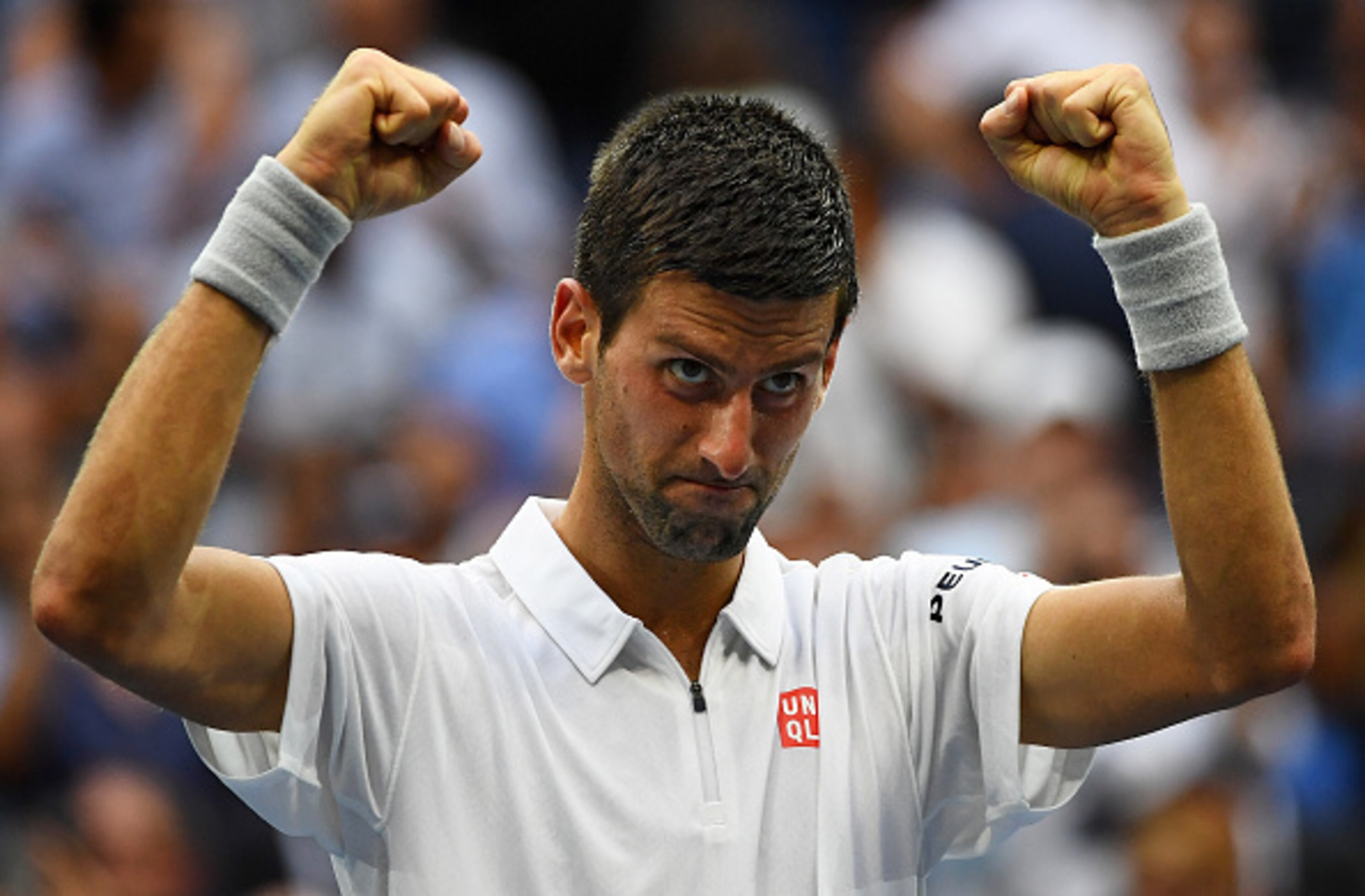 A tired Djokovic celebrates after defeating Monfils in the semifinals.