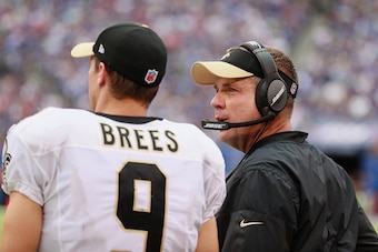 Drew Brees and Sean Payton talk on the sidelines