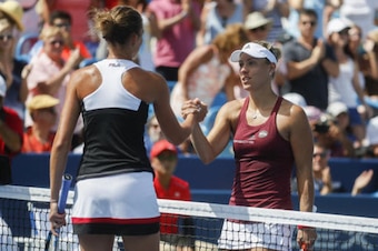 Karolina Pliskova and Angelique Kerber shake hands after competing in the finals at the 2016 Western and Southern Open.