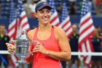 Angelique Kerber poses with the winning trophy after capturing the 2016 U.S. Open title.