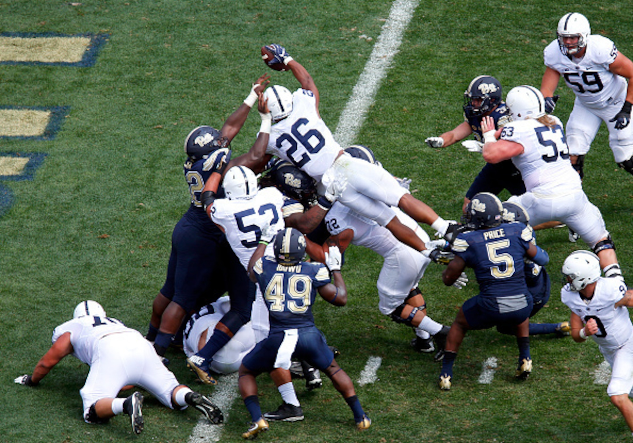 Penn State RB Saquon Barkley leaps over the goal line for a touchdown last Saturday at Pittsburgh.