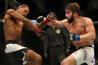 Jimmie Rivera, right, punches Iuri Alcantara.