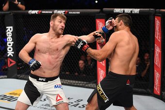 Stipe Miocic, left, punches Fabricio Werdum in his successful title challenge.