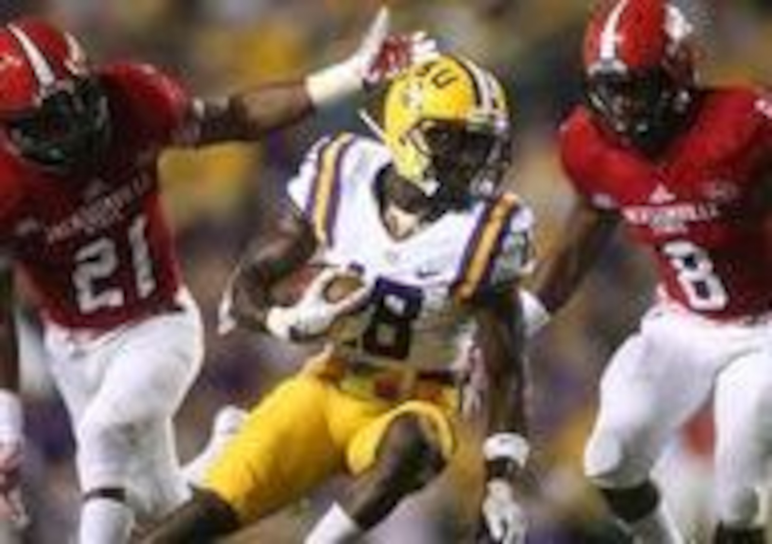 Sep 10, 2016; Baton Rouge, LA, USA; LSU Tigers cornerback Tre'Davious White (18) carries the ball between Jacksonville State Gamecocks safety Delwyn Torbert (21) and  safety Ra'Shad Green (8) as he carries the ball in the first quarter at Tiger Stadium. M