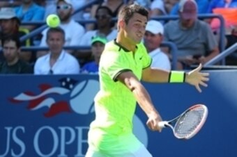 Bernard Tomic hits a backhand during the 2016 U.S. Open.