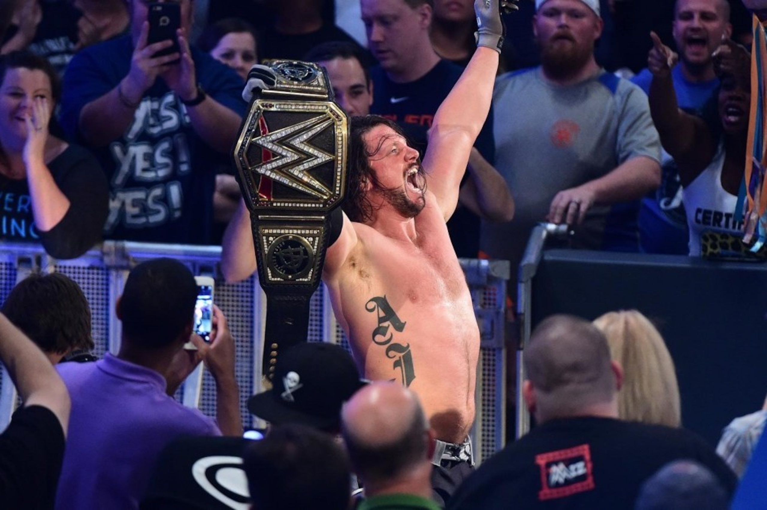 AJ Styles celebrates at Backlash with his new WWE World Championship.