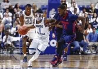 Rhode Island's Jarvis Garrett (1) and Dayton's Scoochie Smith (11)