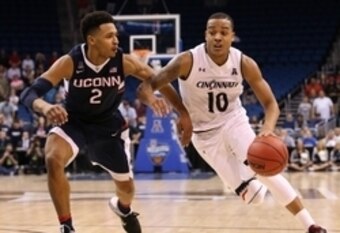 Connecticut's Jalen Adams and Cincinnati's Troy Caupain