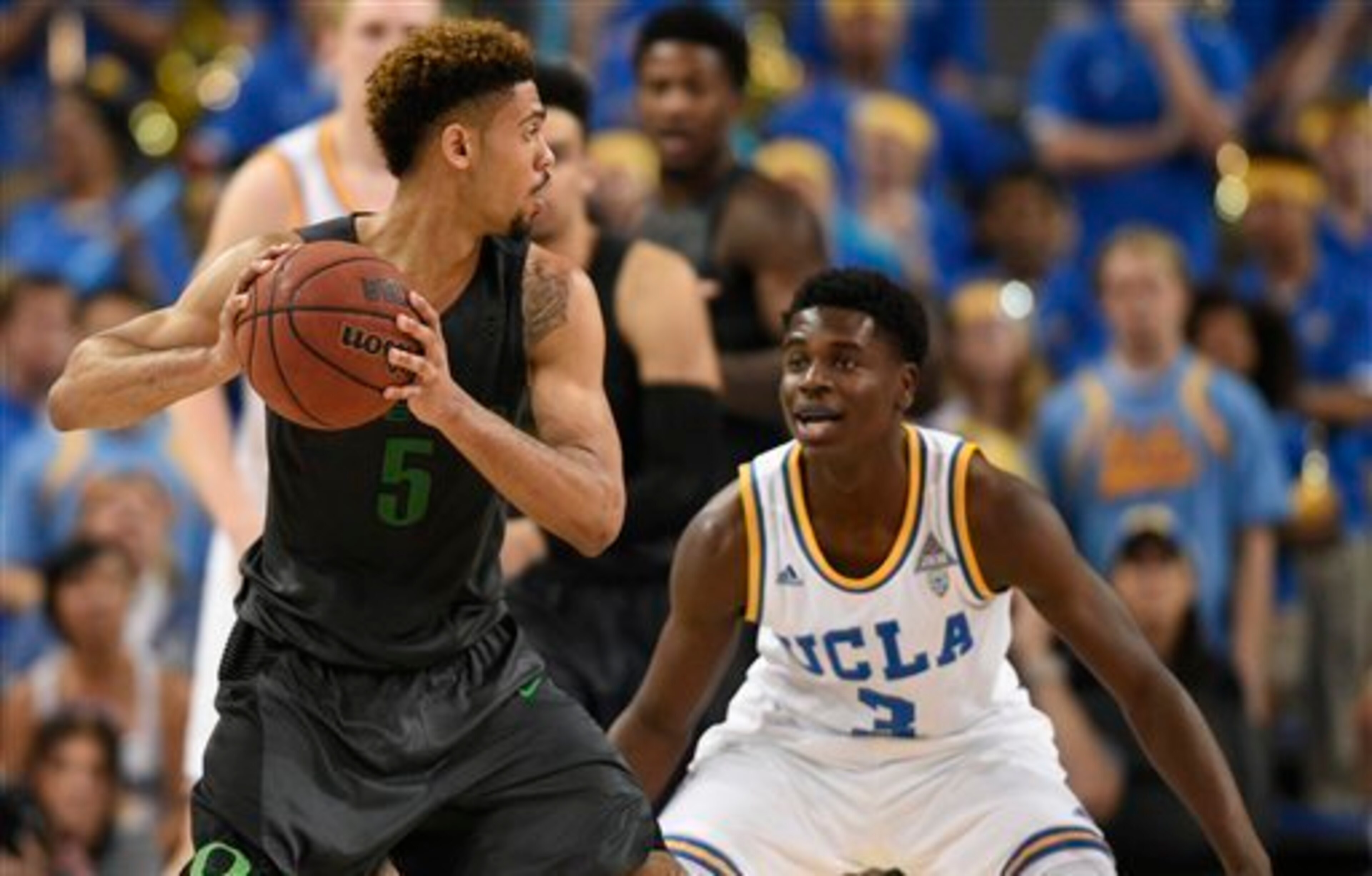 Oregon's Tyler Dorsey (5) and UCLA's Aaron Holiday (3)