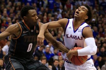 Texas' Tevin Mack and Kansas' Devonte' Graham