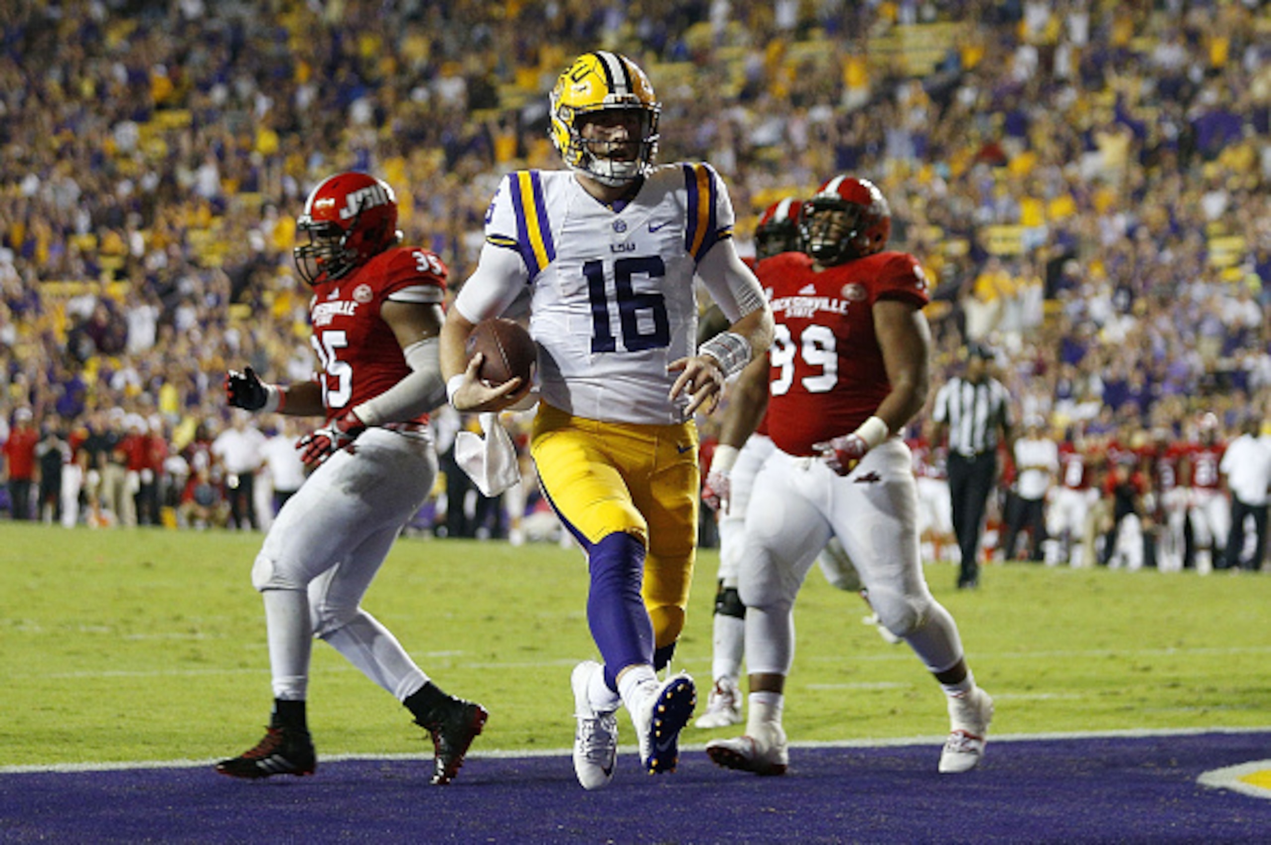BATON ROUGE, LA - SEPTEMBER 10: Danny Etling #16 of the LSU Tigers scores a thouchdown during the second half of a game against the Jacksonville State Gamecocks at Tiger Stadium on September 10, 2016 in Baton Rouge, Louisiana.  (Photo by Jonathan Bachman/