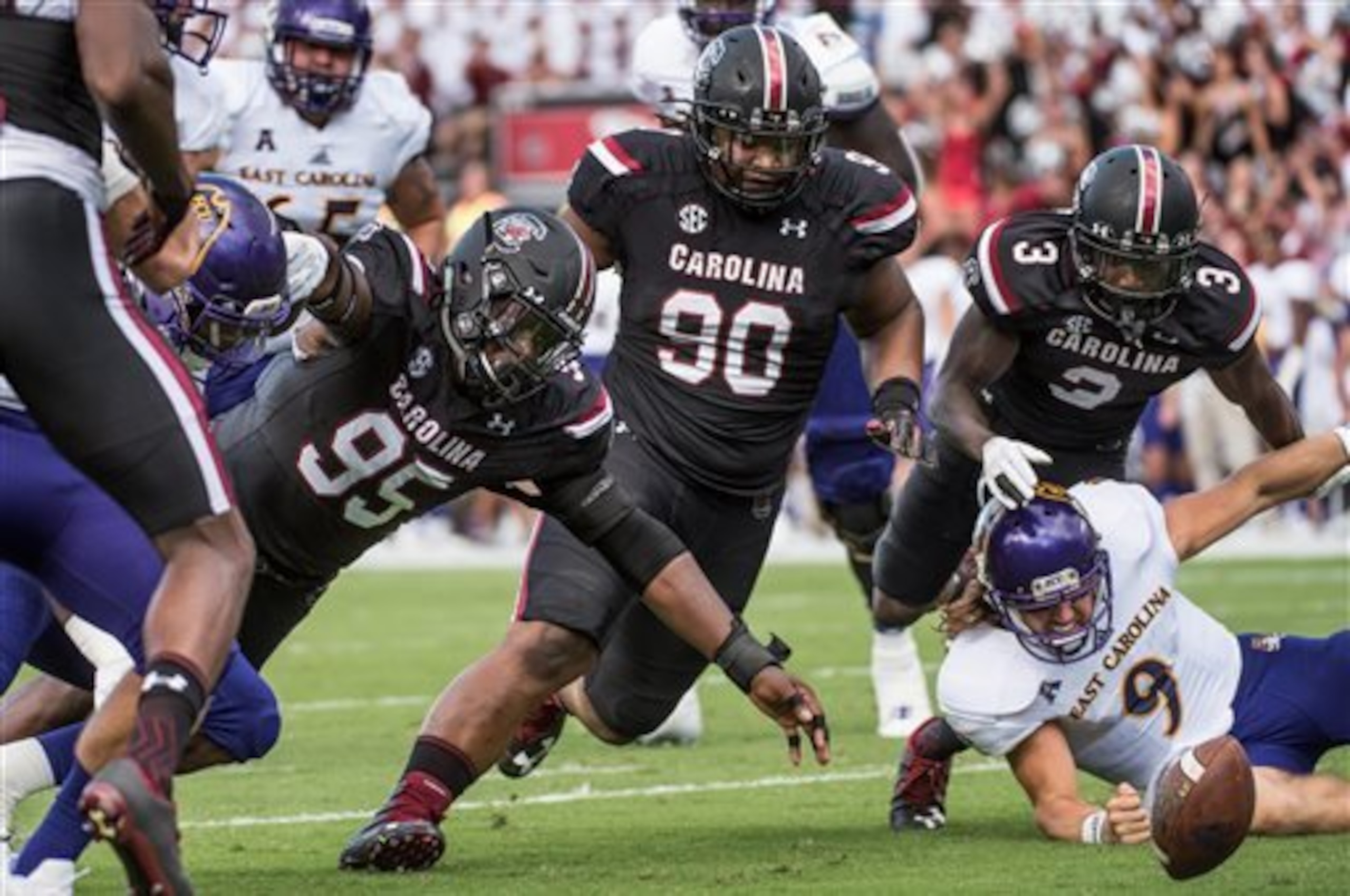 Chris Lammons (No. 3) forces a fumble.