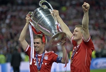 Lahm (left) captained Bayern to Champions League glory in 2013.