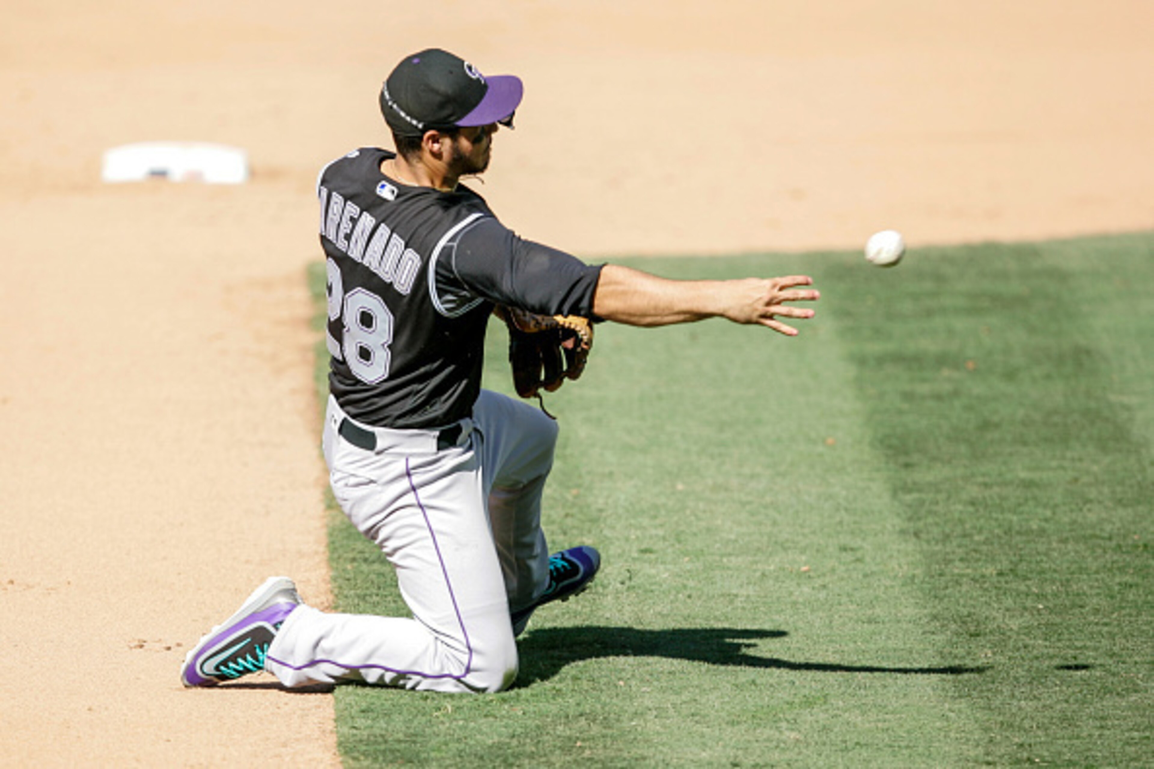 Along with stellar offense inflated by Coors Field, third baseman Nolan Arenado plays Gold Glove defense for the Colorado Rockies.
