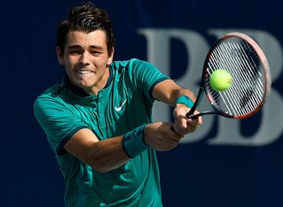 Taylor Fritz hits a backhand during a match at the 2016 Winston-Salem Open.