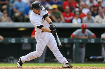 DENVER, CO - SEPTEMBER 21:  Tom Murphy #23 of the Colorado Rockies hits a three-run home run during the seventh inning against the St. Louis Cardinals at Coors Field on September 21, 2016 in Denver, Colorado. (Photo by Justin Edmonds/Getty Images)