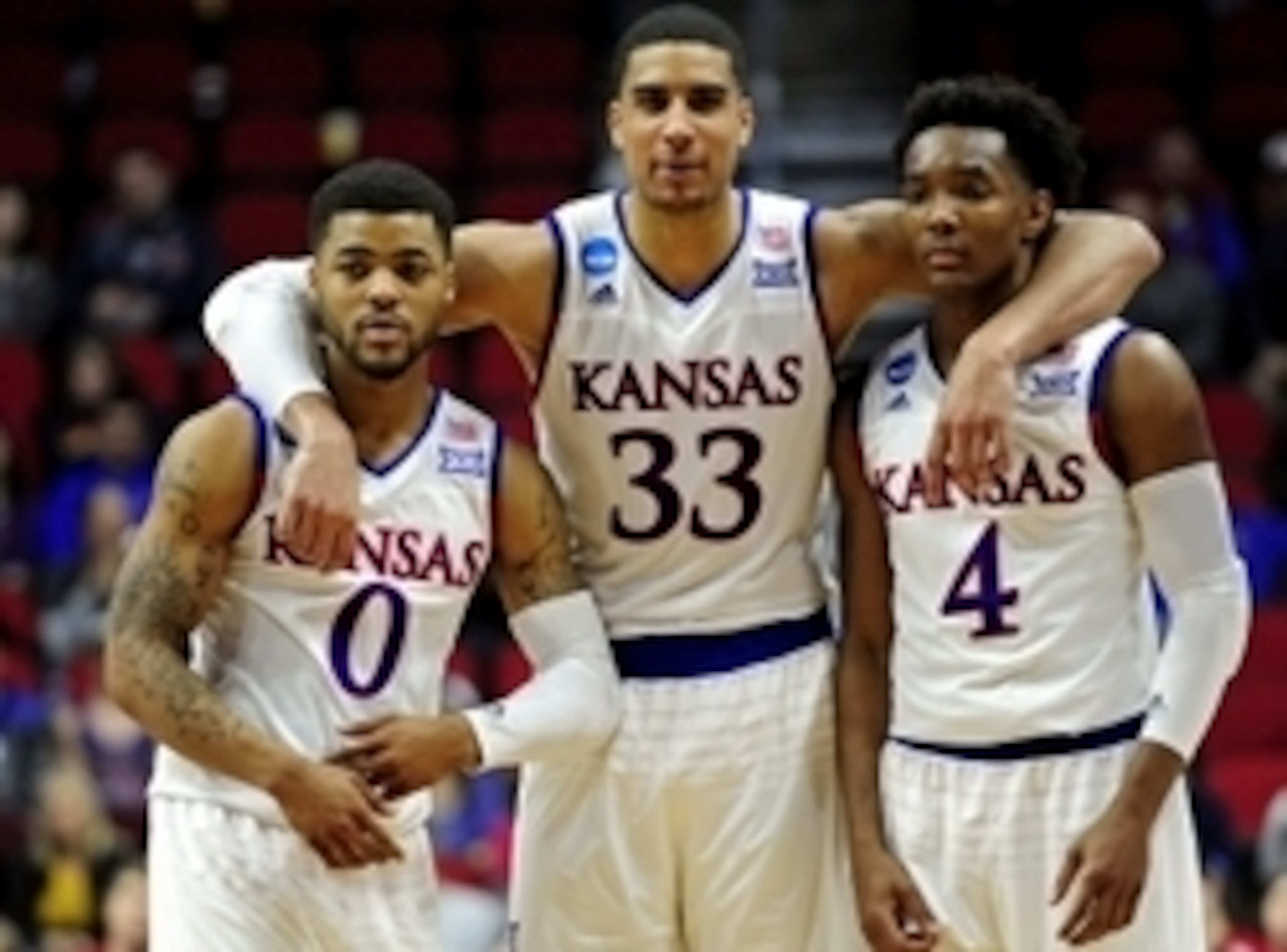 Mar 19, 2016; Des Moines, IA, USA; Kansas Jayhawks guard Frank Mason III (0), forward Landen Lucas (33) and guard Devonte' Graham (4) on the court in the second half against the Connecticut Huskies during the second round of the 2016 NCAA Tournament at We