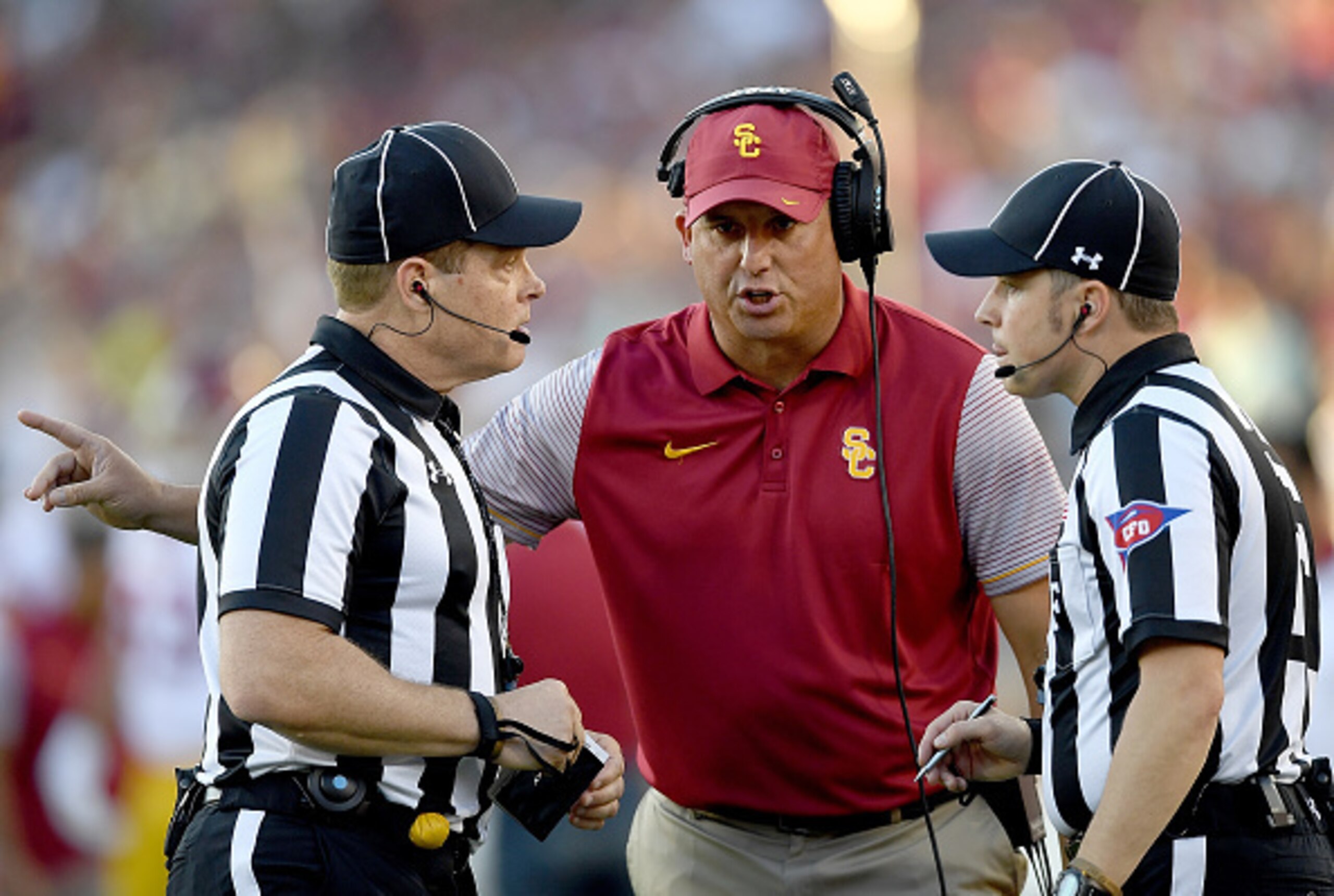 PALO ALTO, CA - SEPTEMBER 17:  Head coach Clay Helton of the USC Trojans talks with the officials during a break in the action against the Stanford Cardinal in the first half of their NCAA football game at Stanford Stadium on September 17, 2016 in Palo Al