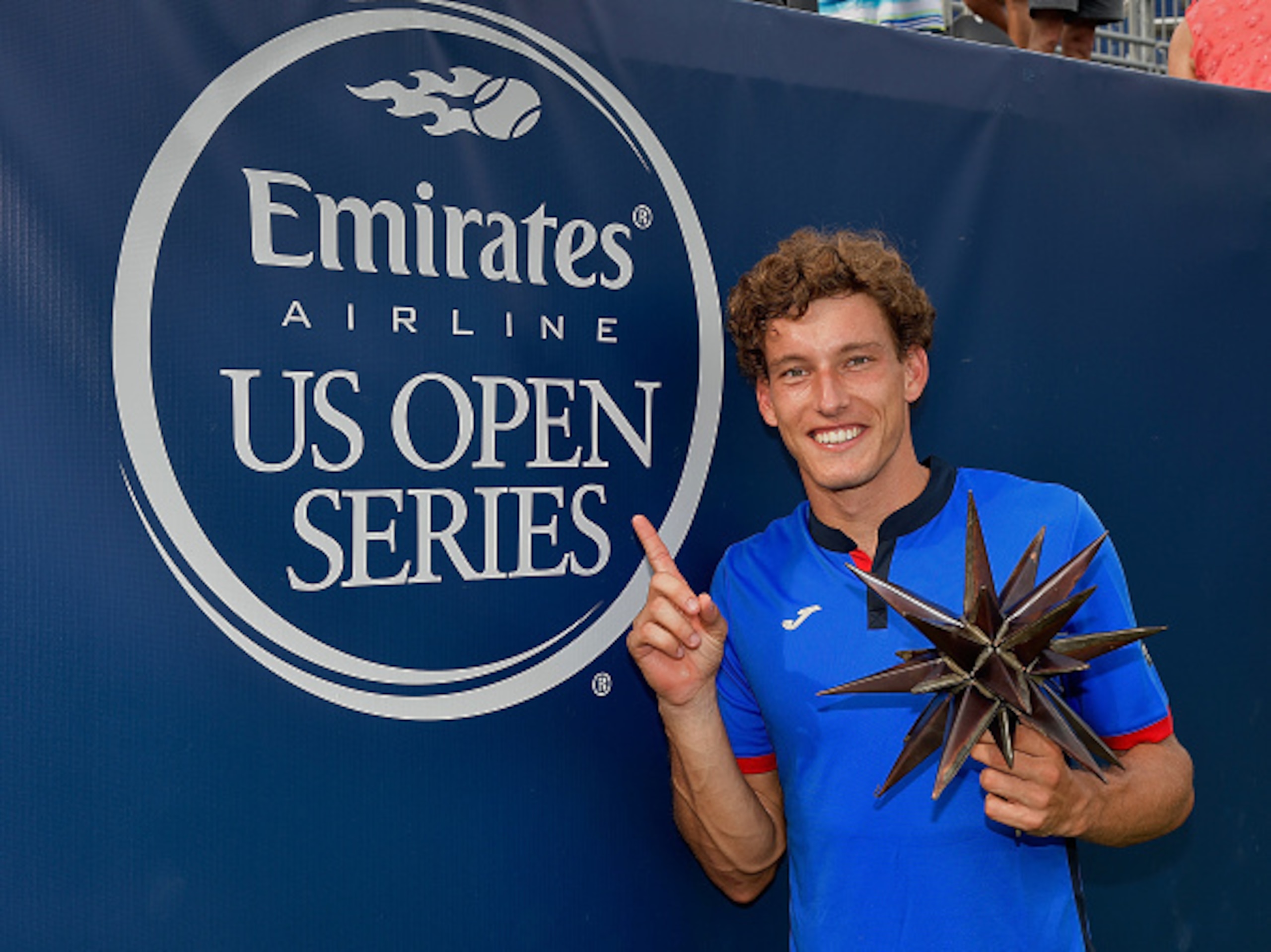 WINSTON SALEM, NC - AUGUST 27:  Pablo Carreno Busta of Spain holds the trophy after his win over Roberto Bautista Agut of Spain in the men's singles championship final of the Winston-Salem Open at Wake Forest University on August 27, 2016 in Winston Salem