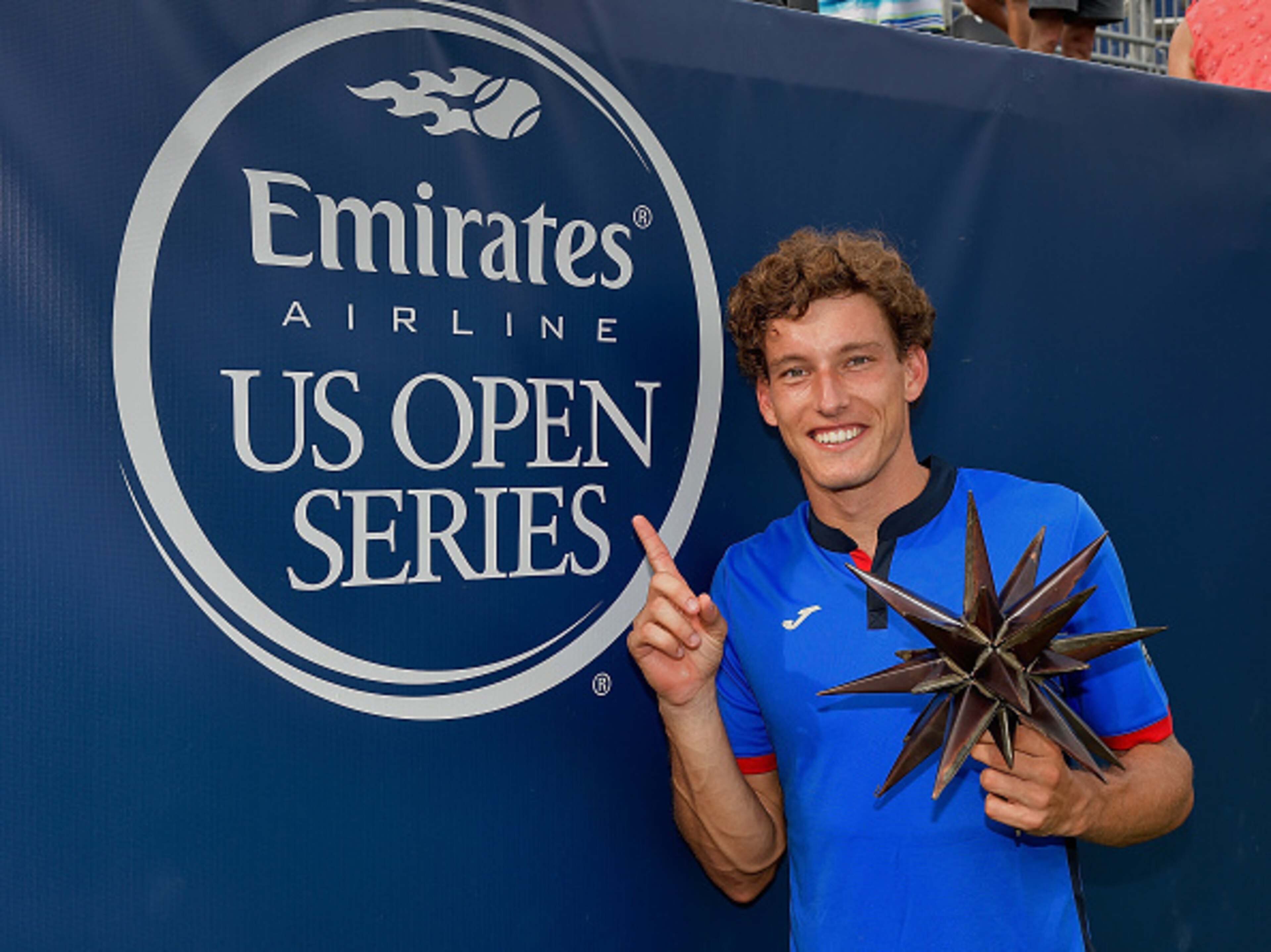 WINSTON SALEM, NC - AUGUST 27: Pablo Carreno Busta of Spain holds the trophy after his win over Roberto Bautista Agut of Spain in the men's singles championship final of the Winston-Salem Open at Wake Forest University on August 27, 2016 in Winston Salem WINSTON SALEM, NC - AUGUST 27: Pablo Carreno Busta of Spain holds the trophy after his win over Roberto Bautista Agut of Spain in the men's singles championship final of the Winston-Salem Open at Wake Forest University on August 27, 2016 in Winston Salem