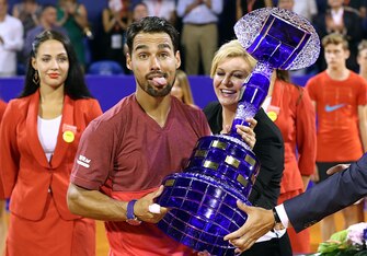 Fabio Fognini has fun with the trophy he won with his 2016 Croatian Open title.