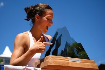 Switzerland's Viktorija Golubic poses with the trophy after her victory 4-6, 6-3, 6-4 against Netherland's Kiki Bertens during the final game at the Ladies Championship Gstaad WTA tennis tournament on July 17, 2016 in Gstaad. / AFP / FABRICE COFFRINI     