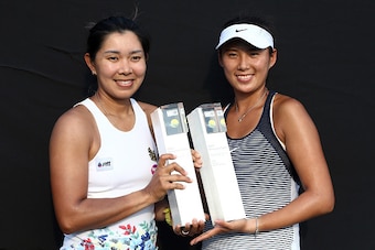 KUALA LUMPUR, MALAYSIA - MARCH 06:  Varatchata Wongteanchai (L) of Thailand and Zhaoxuan Yang of China pose with the BMW Malaysian Open Doubles Champion Trophy after the Doubles Final of the 2016 BMW Malaysian Open at Kuala Lumpur Golf & Country Club on M