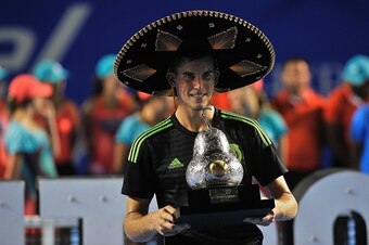 Dominic Thiem holds the 2016 Mexican Open trophy.