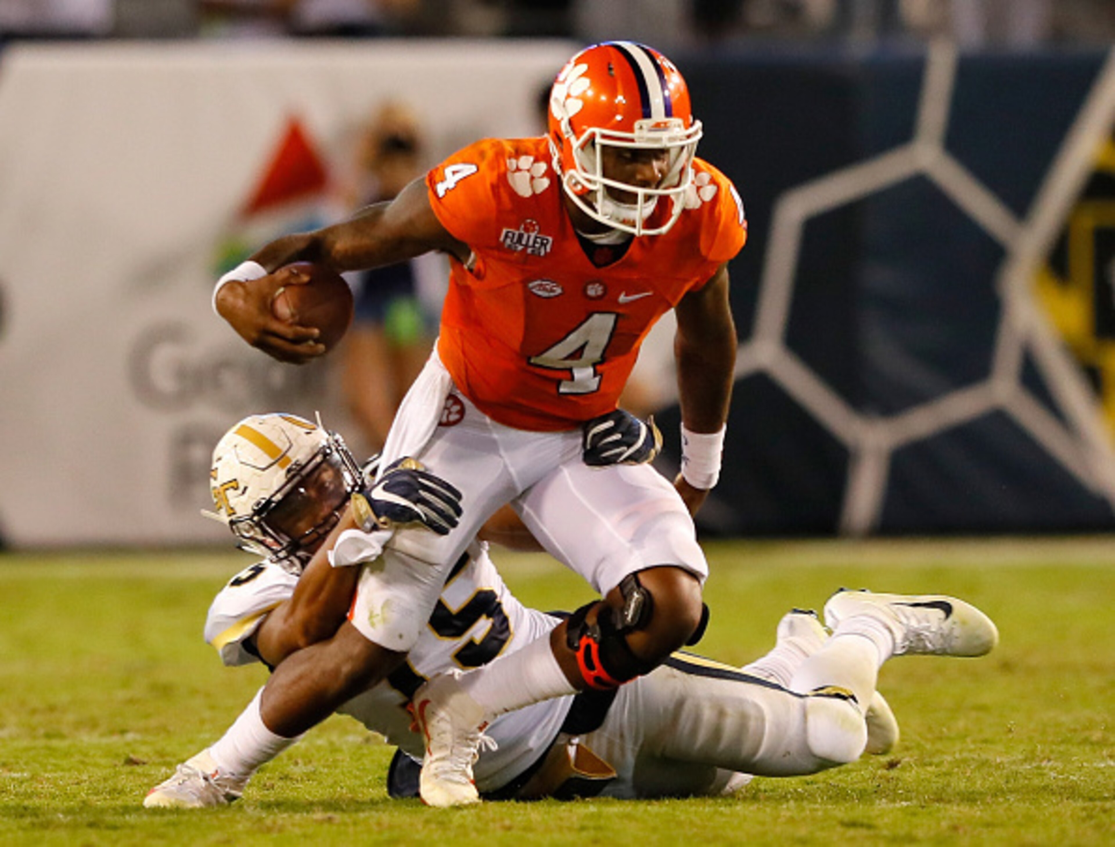 ATLANTA, GA - SEPTEMBER 22:  Deshaun Watson #4 of the Clemson Tigers attempts to break a tackle by A.J. Gray #15 of the Georgia Tech Yellow Jackets at Bobby Dodd Stadium on September 22, 2016 in Atlanta, Georgia.  (Photo by Kevin C. Cox/Getty Images)