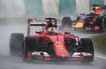 Sebastian Vettel navigates a wet qualifying session at the 2015 Malaysian Grand Prix.