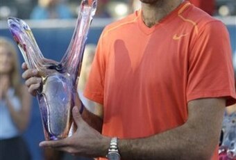Juan Martin Del Potro shows off a trophy he won at the 2011 Delray Beach.